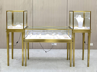 //iirorwxhrpmpln5m-static.micyjz.com/cloud/lnBpmKnqlrSRmkrklnrnjq/Titanium-gold-combination-set-jewelry-display-cabinet.jpg